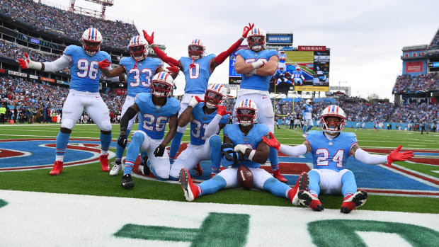 Tennessee Titans defenders celebrate after a turnover during the first half against the Atlanta Falcons at Nissan Stadium.
